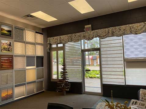 Store interior showcasing several different types of window coverings